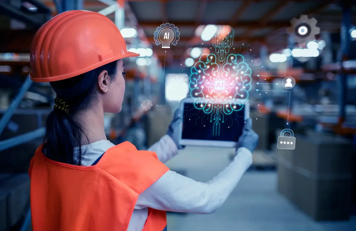 Field worker in a hard hat using a tablet with AI data overlay