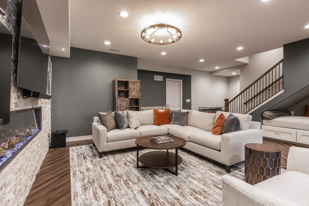 Finished basement remodel with a fireplace and sectional seating