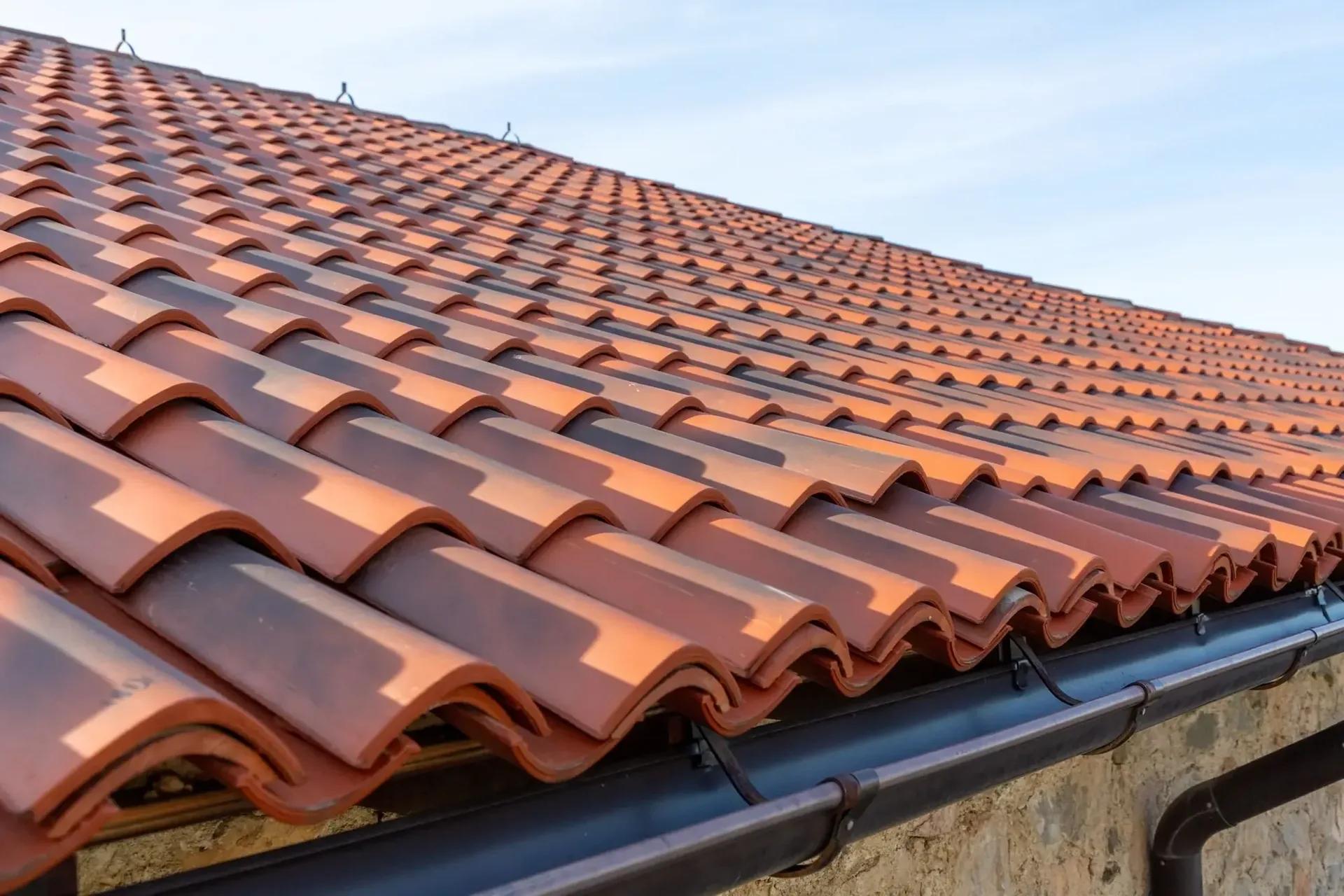 Terracotta tile roof on a completed residential roofing project