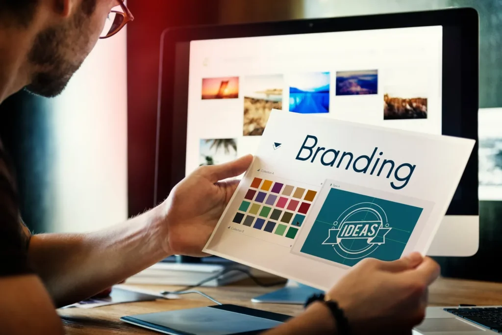 Designer workspace with brand colour swatches and logo concepts