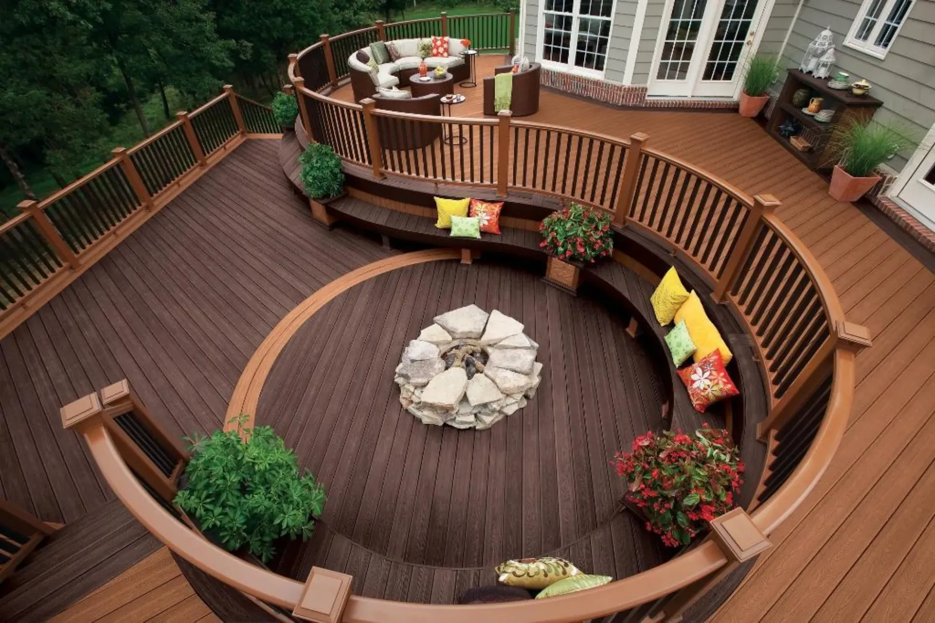 Curved wooden deck with built in bench seating and planters