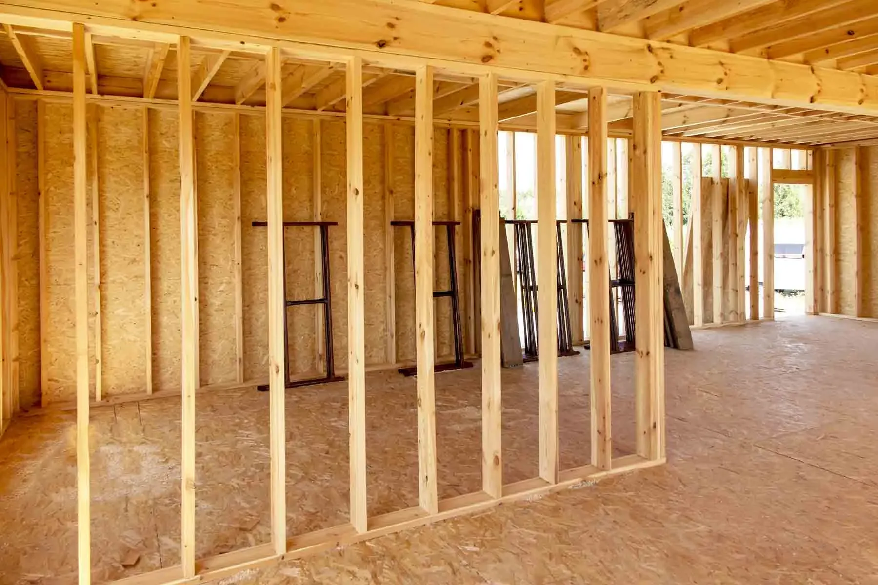 Interior wood stud wall framing inside a house under construction