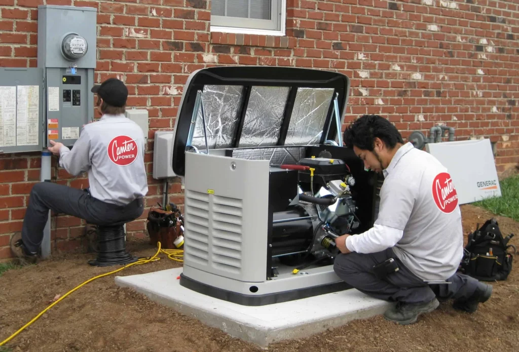 Two technicians installing a standby generator beside a brick home