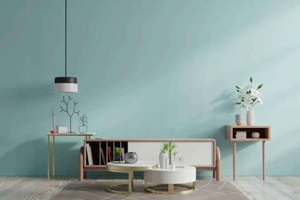 Freshly painted living room with a soft teal accent wall