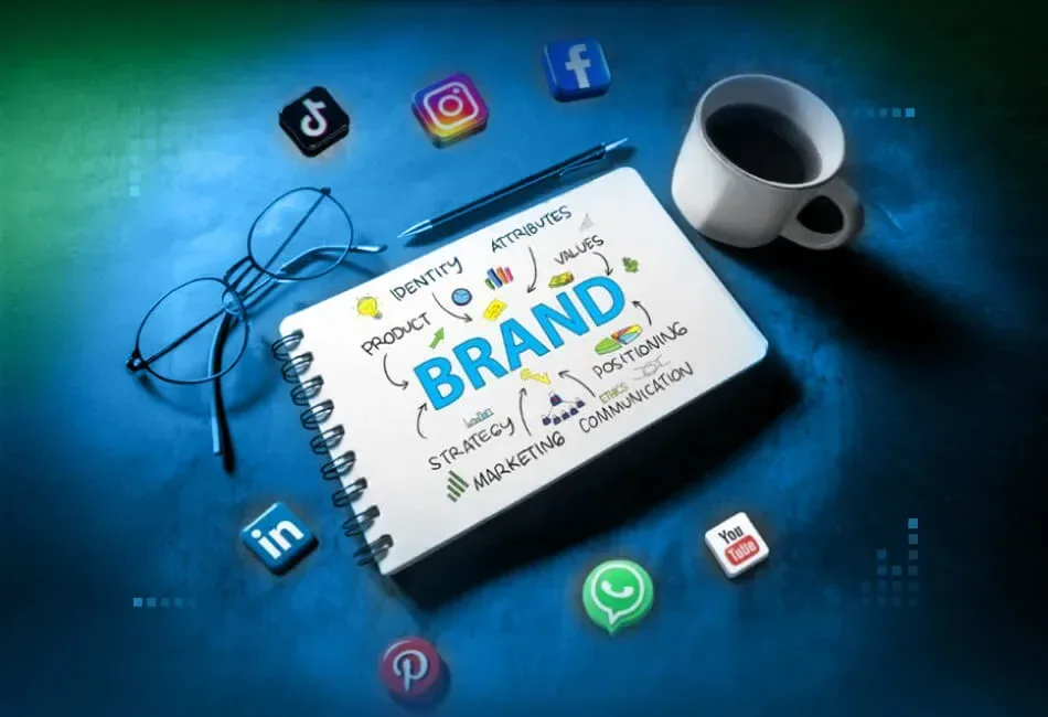 Notebook and social media icons used for planning brand content